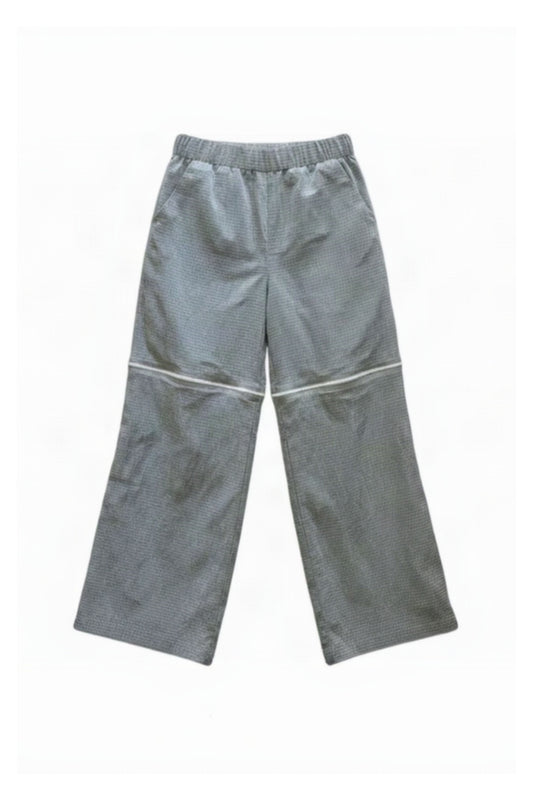 A pair of gray wide-leg pants with a matching gray elastic waistband, laid flat against a white background MARJ