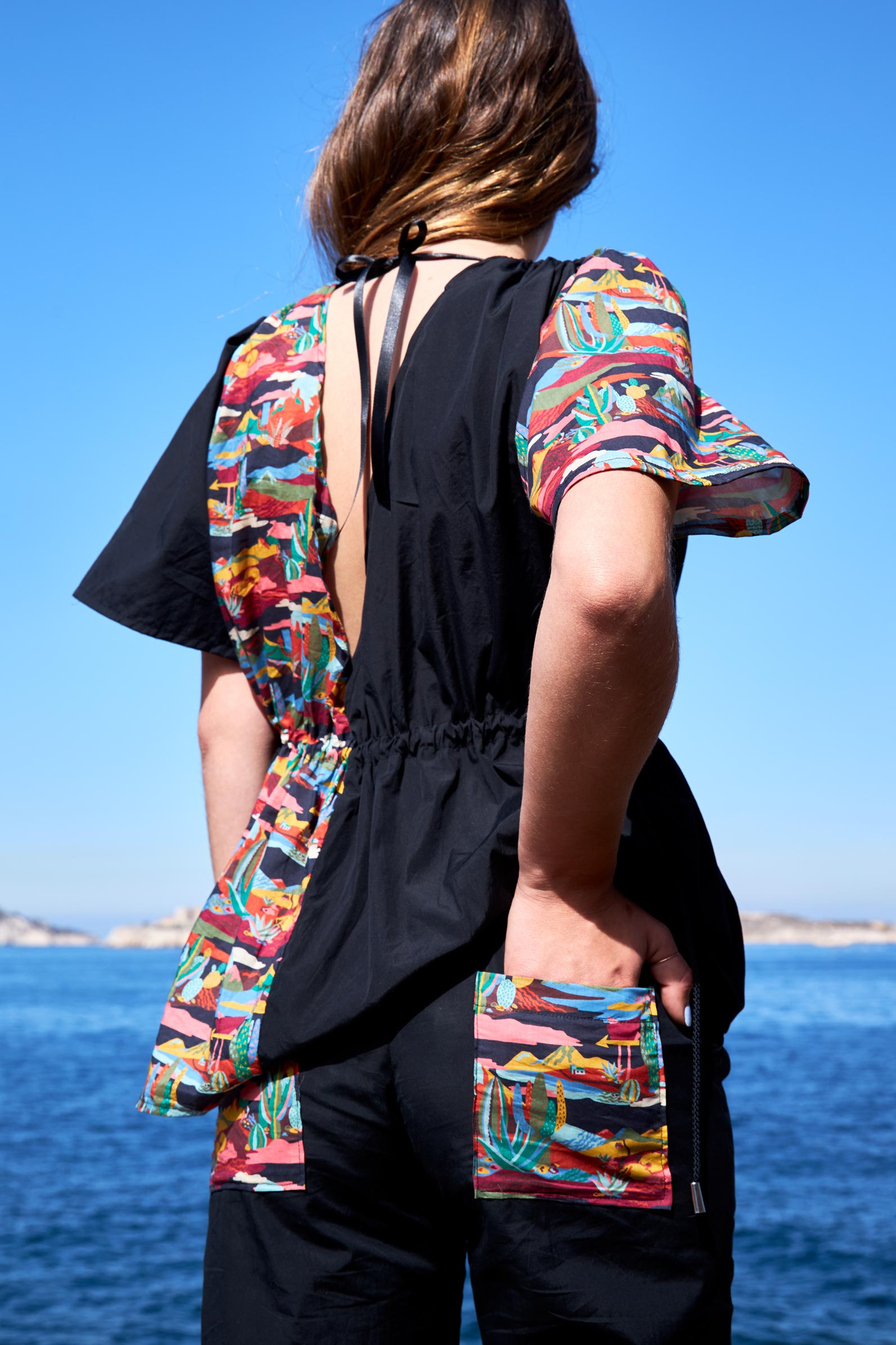 Back of the SS22 MARJ top with cape sleeves comfy adjustable waist in upcycling fabric sustainable